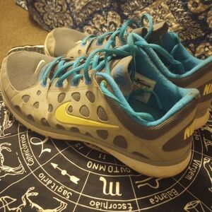 Nike Gray Sneakers with Blue and Yellow Accents